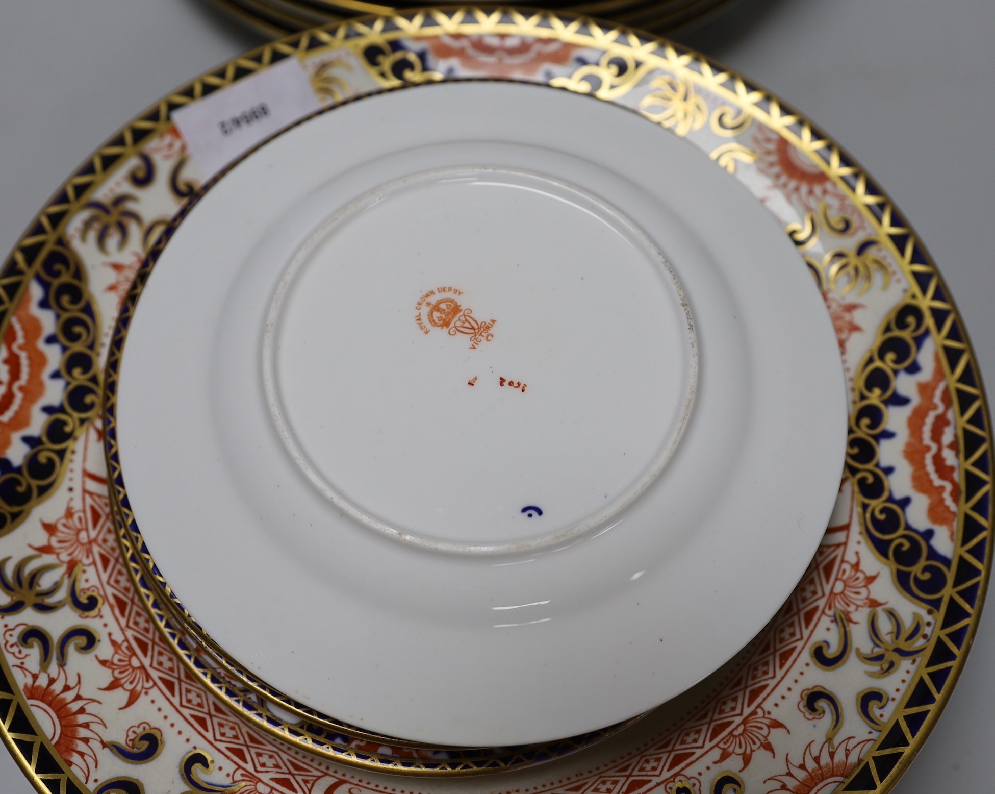A part set of Royal Crown Derby Imari pattern plates (12 large and 11 small) 17cm & 26cm